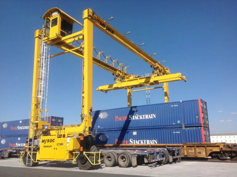 yellow mj50c travelift lifting blue container