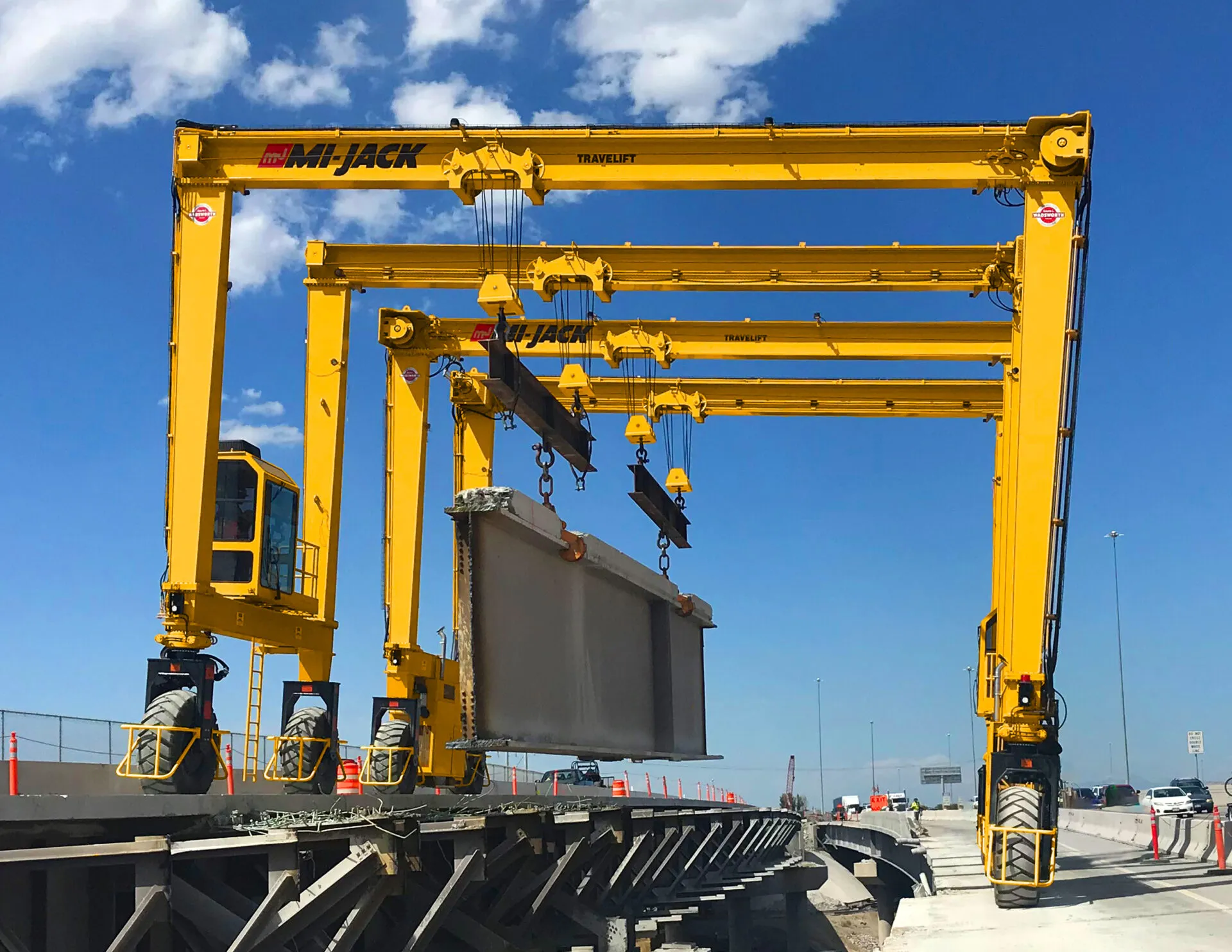 a mi-jack mj40hd travelift lifting a concrete slab