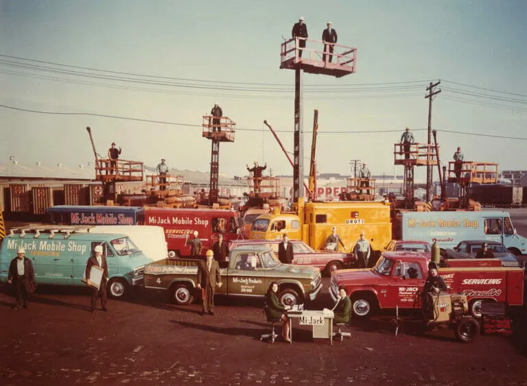 The Mi-Jack team in the 1960s pose with variety of equipment