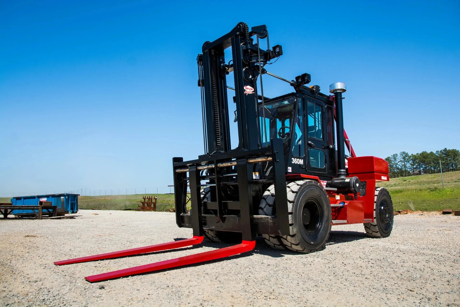 red taylor x360m forklift against a blue sky