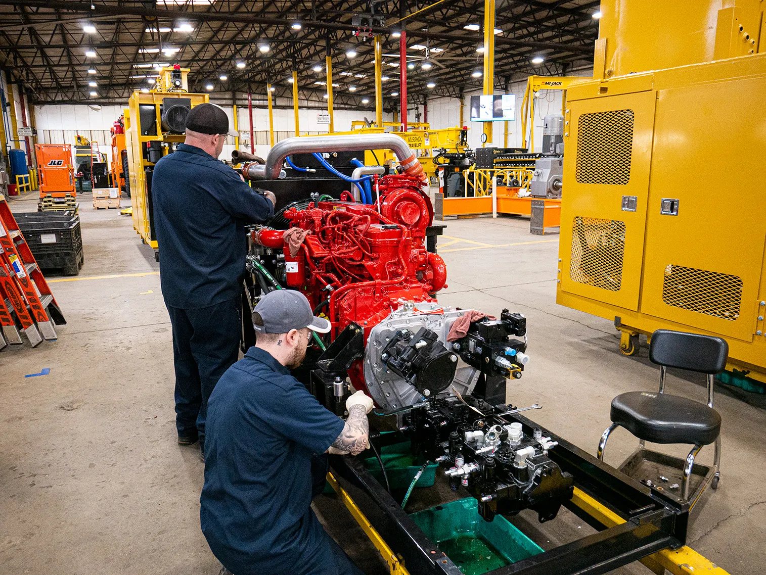 Two mi-jack technicians working in the rtg manufacturing plant