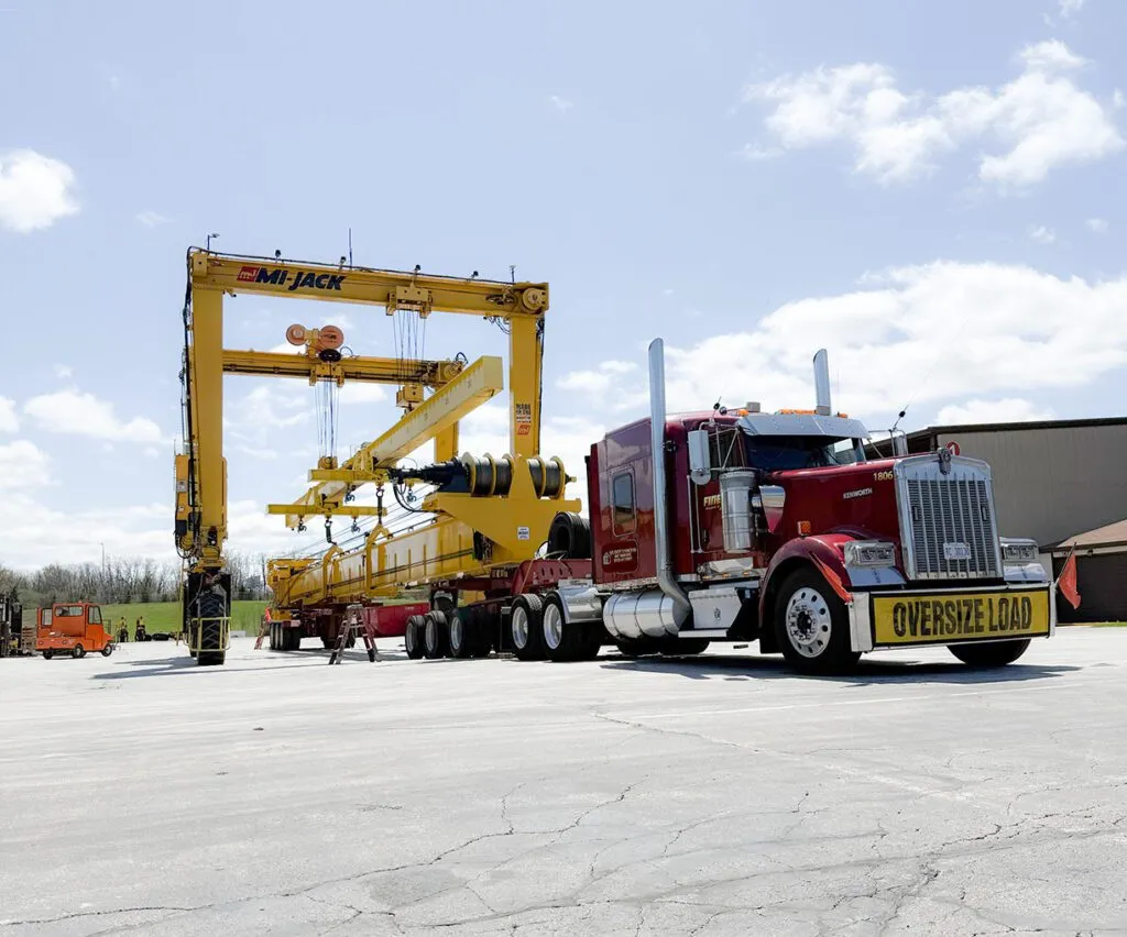truck hauling mj200hd travelift rtg crane